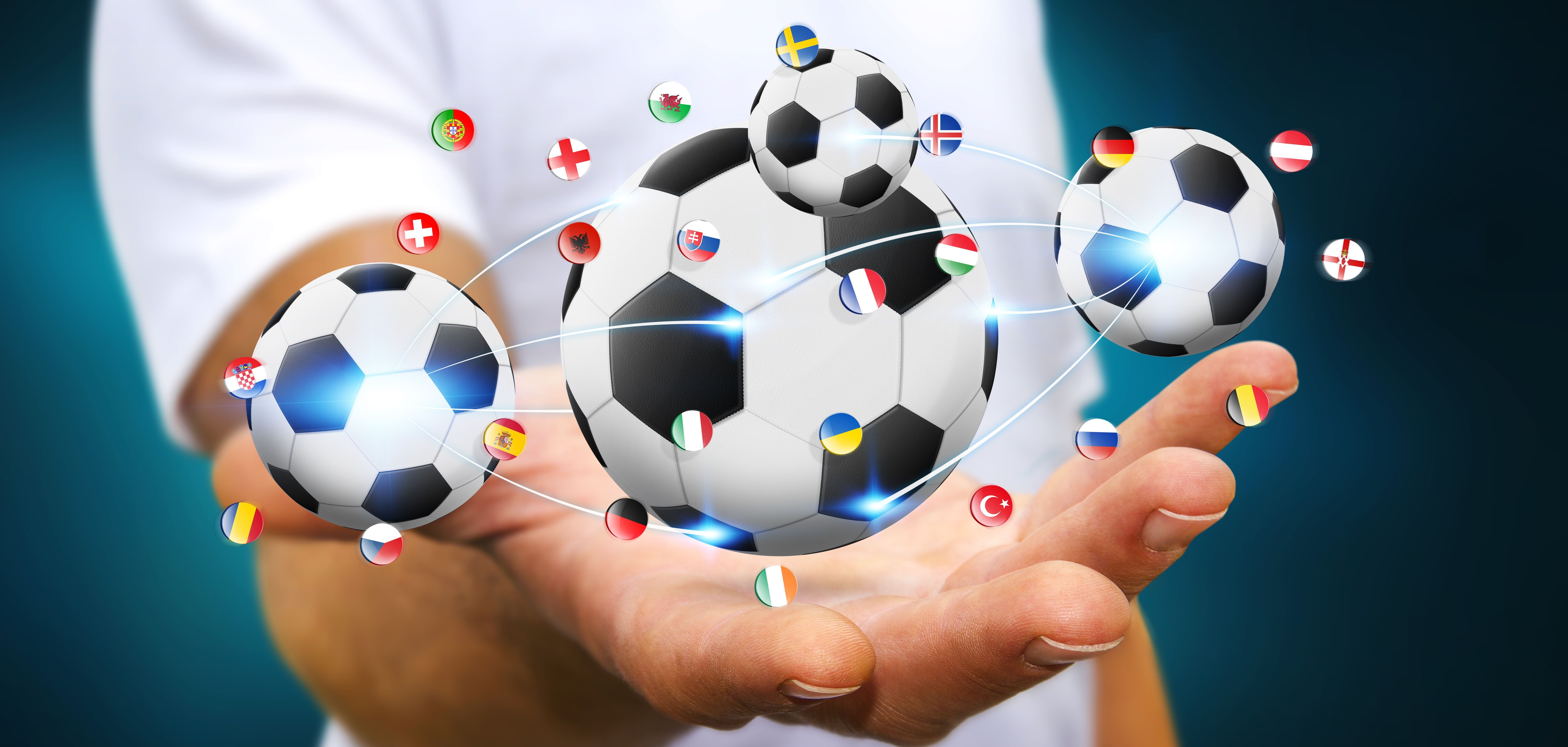 Businessman holding football in his hand