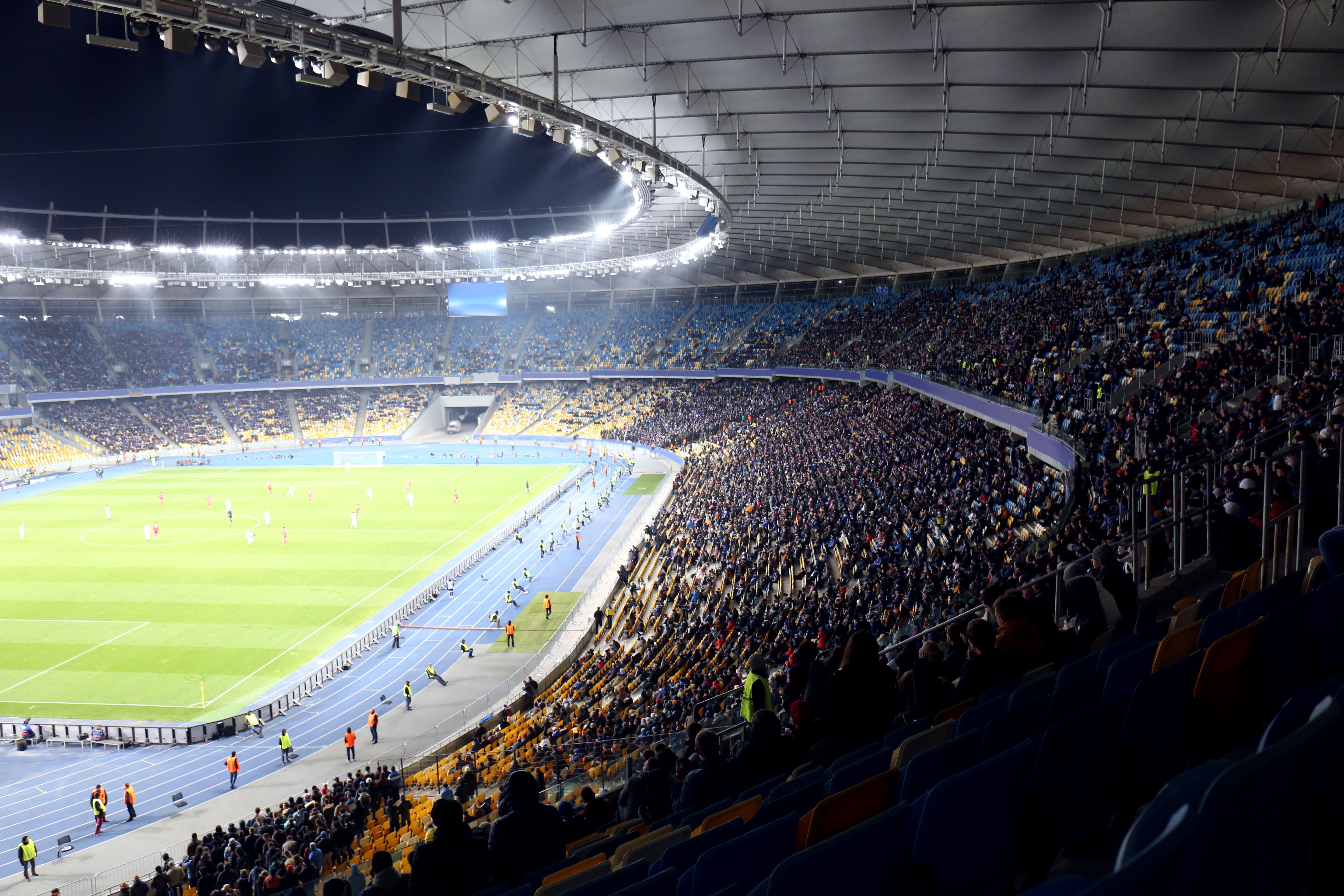 Panoramic view of modern stadium during football match