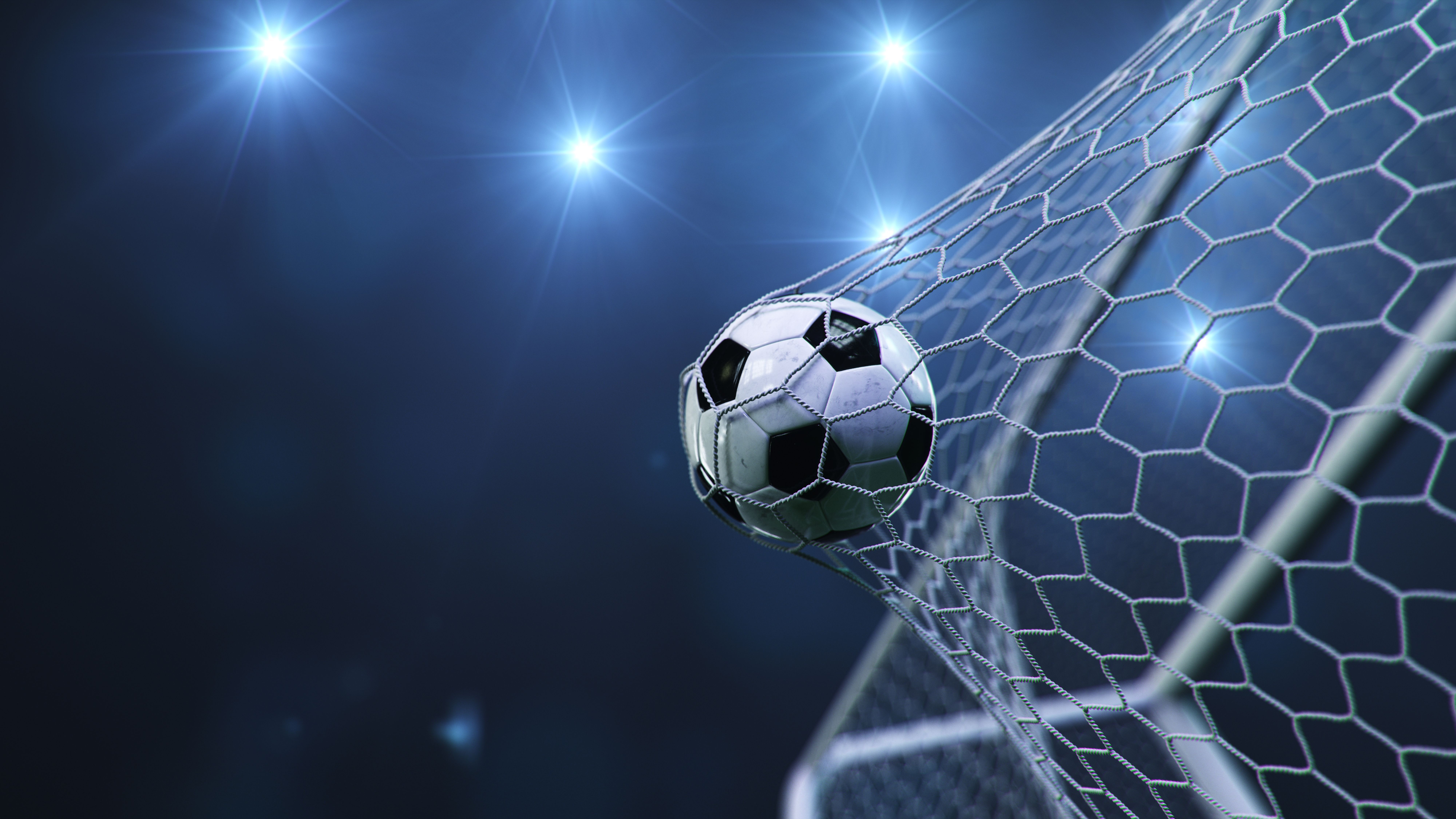 Soccer ball flew into the goal. Soccer ball bends the net, against the background of flashes of light. Soccer ball in goal net on blue background. A moment of delight. 3D illustration