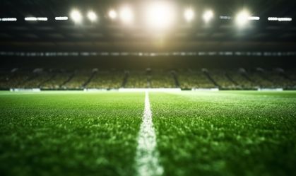 Grass close up in sports arena  on football soccer stadium with lights background . Ground view