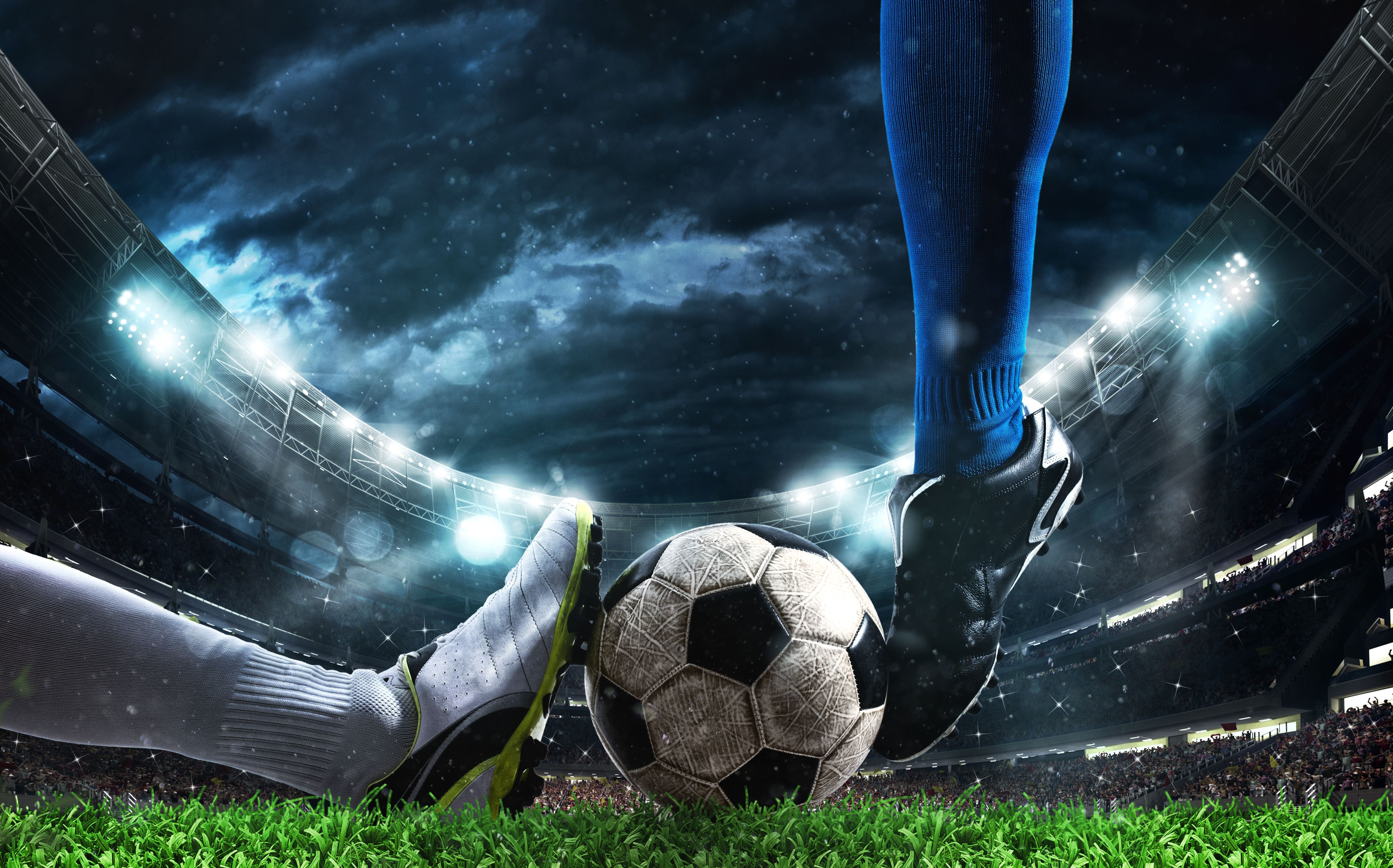 Close up of a football action scene with competing soccer players at the stadium