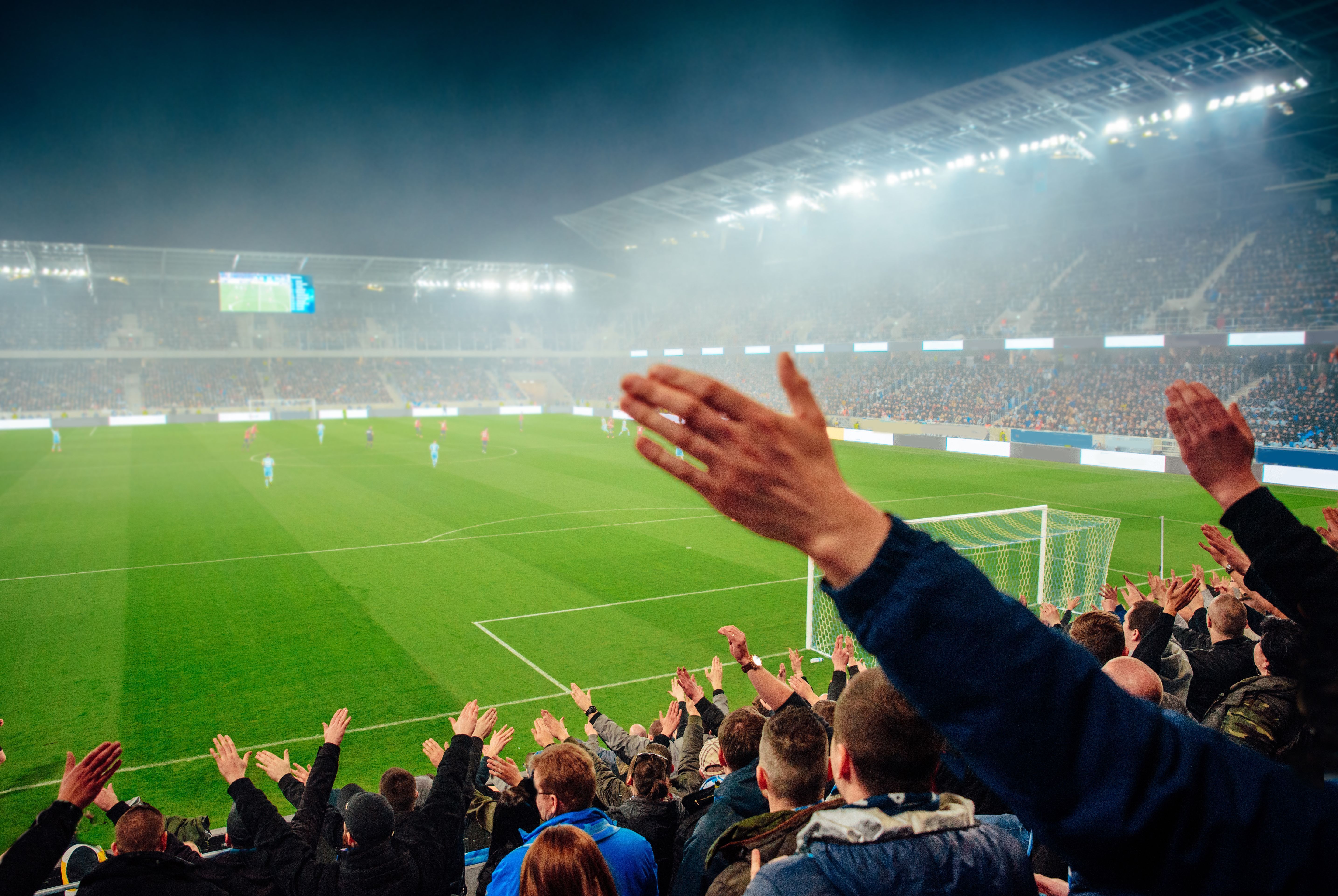 Football fans support the team at the Stadium