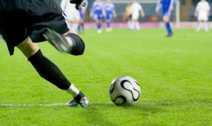 Soccer or football goalkeeper kick the ball