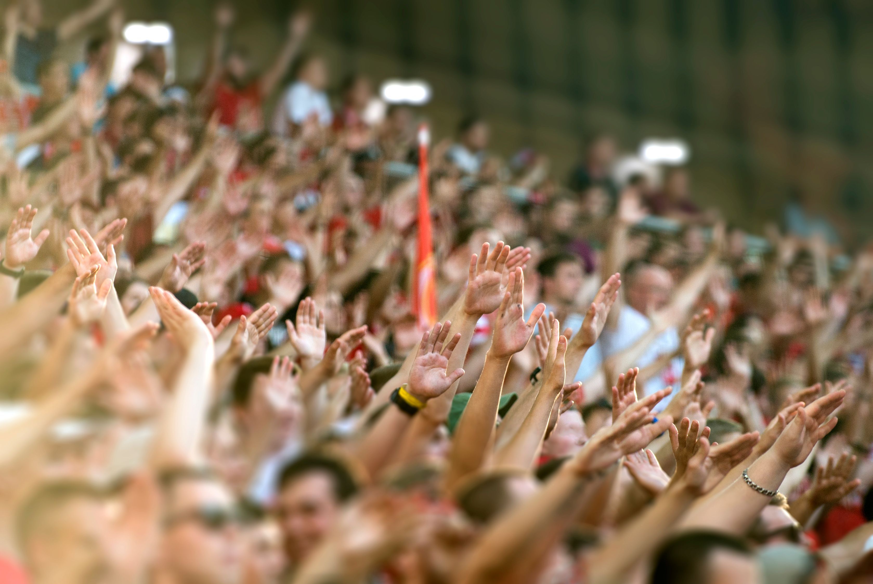 Football fans clapping on the podium of the stadium