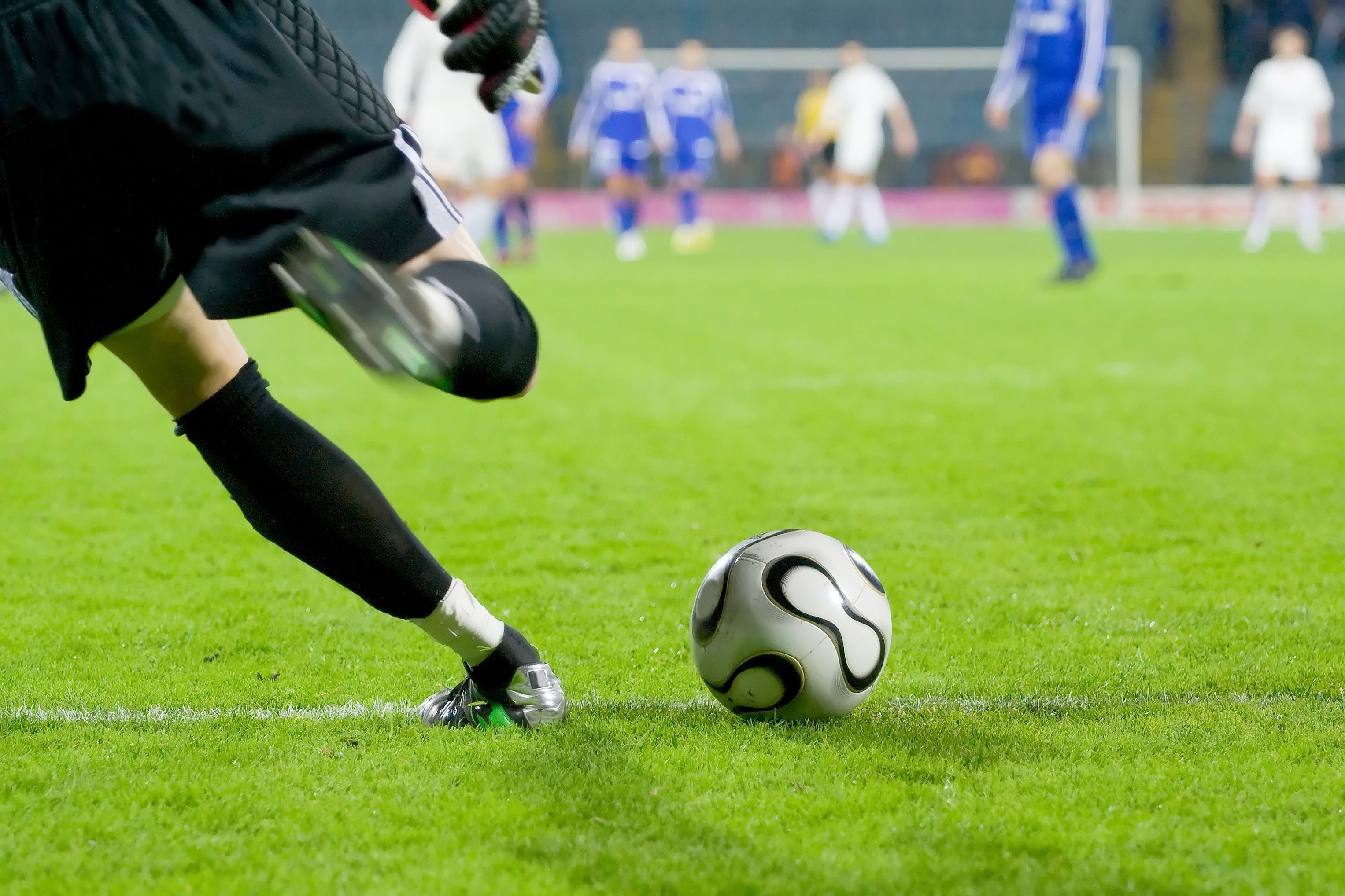 Soccer or football goalkeeper kick the ball