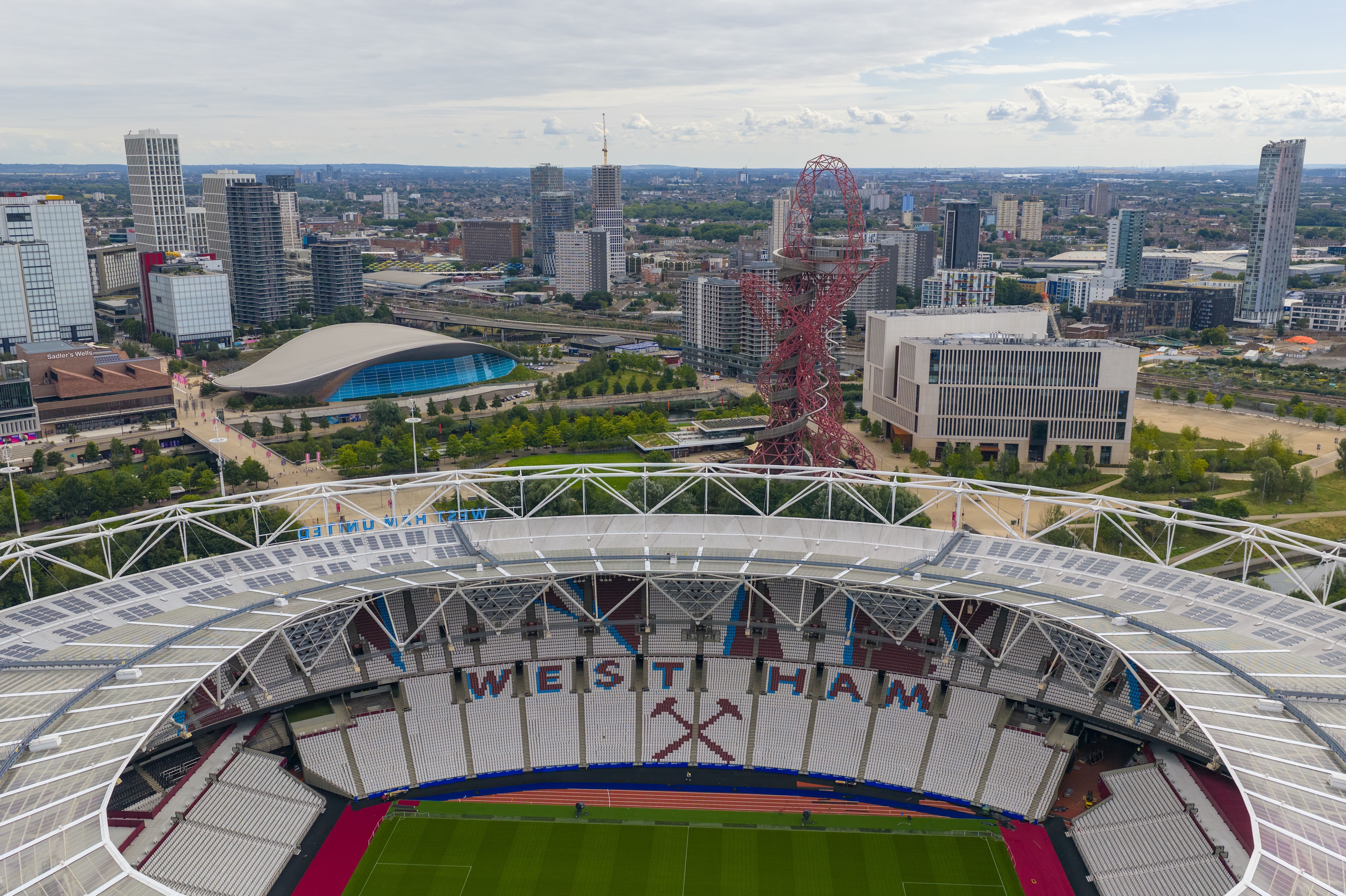 Aerial view of West Ham (London Stadium) with Stratford Skyline e on the background.