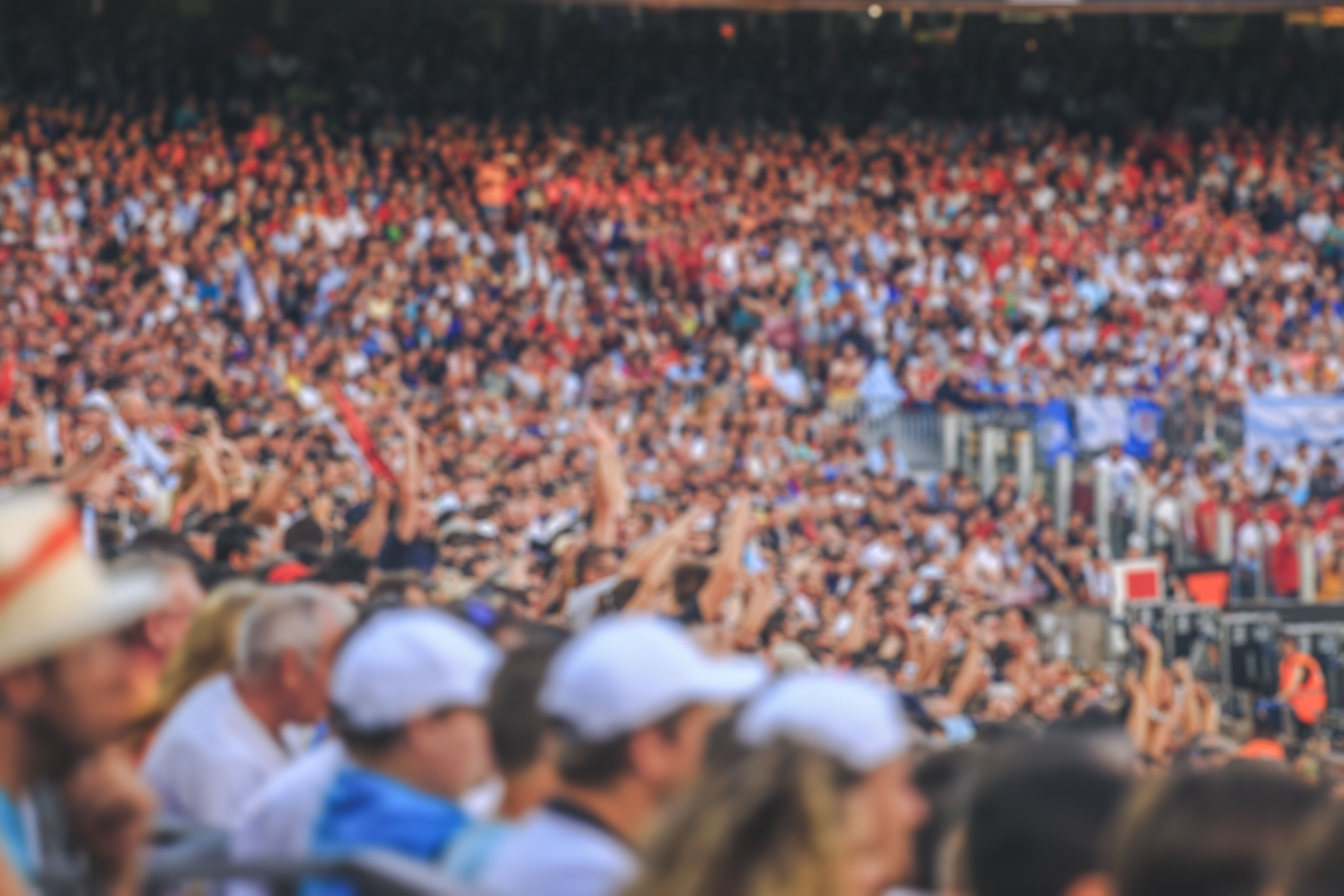 Blurred crowd of spectators on stadium at a sporting event