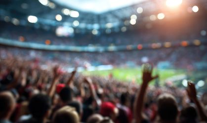 blur background of football or soccer fans at a game in a stadium