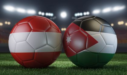 Two soccer balls in flags colors on a stadium blurred background. Austria vs Jordan. 3D image.