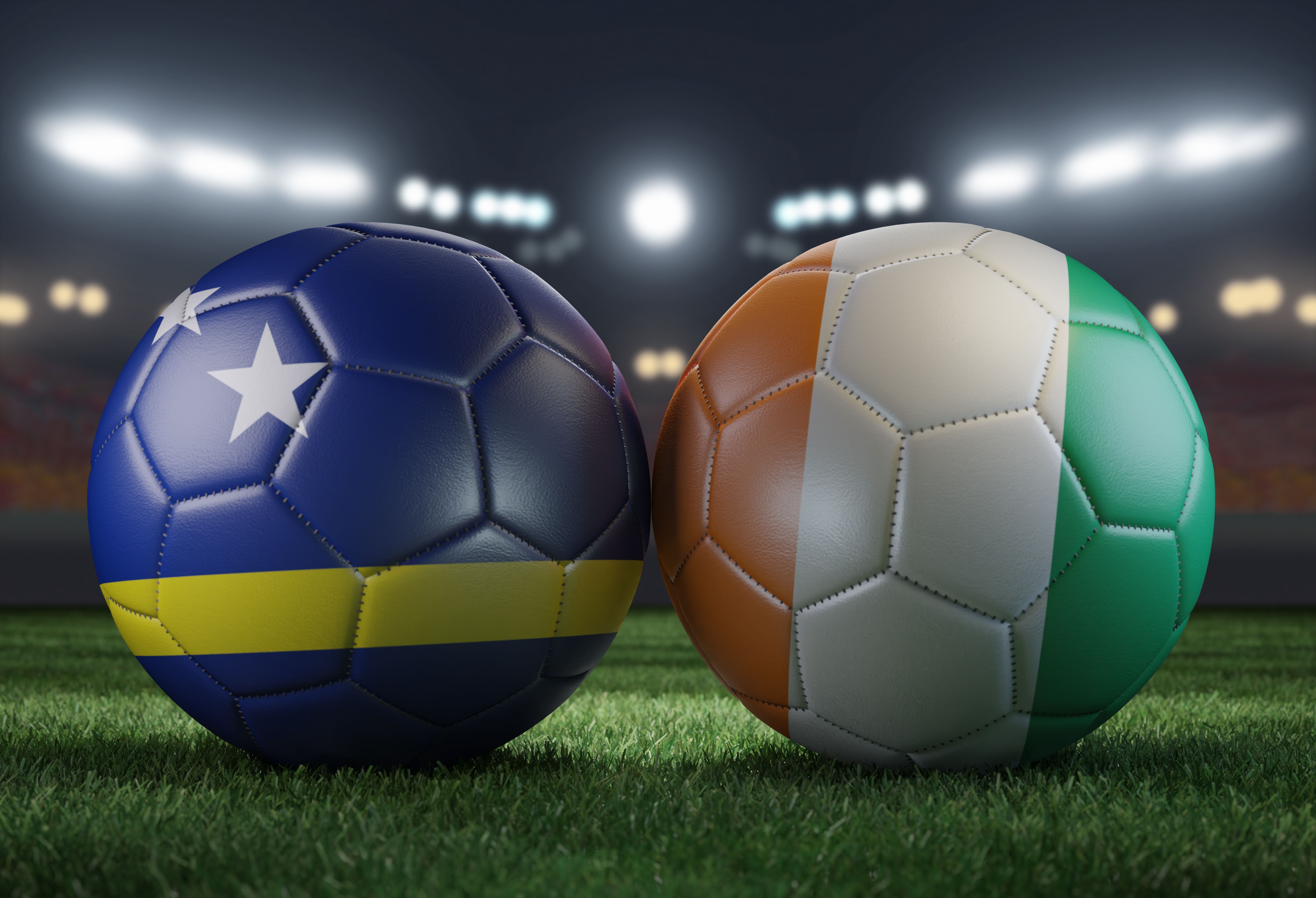 Two soccer balls in flags colors on a stadium blurred background. Curacao vs Ivory Coast. 3D image.