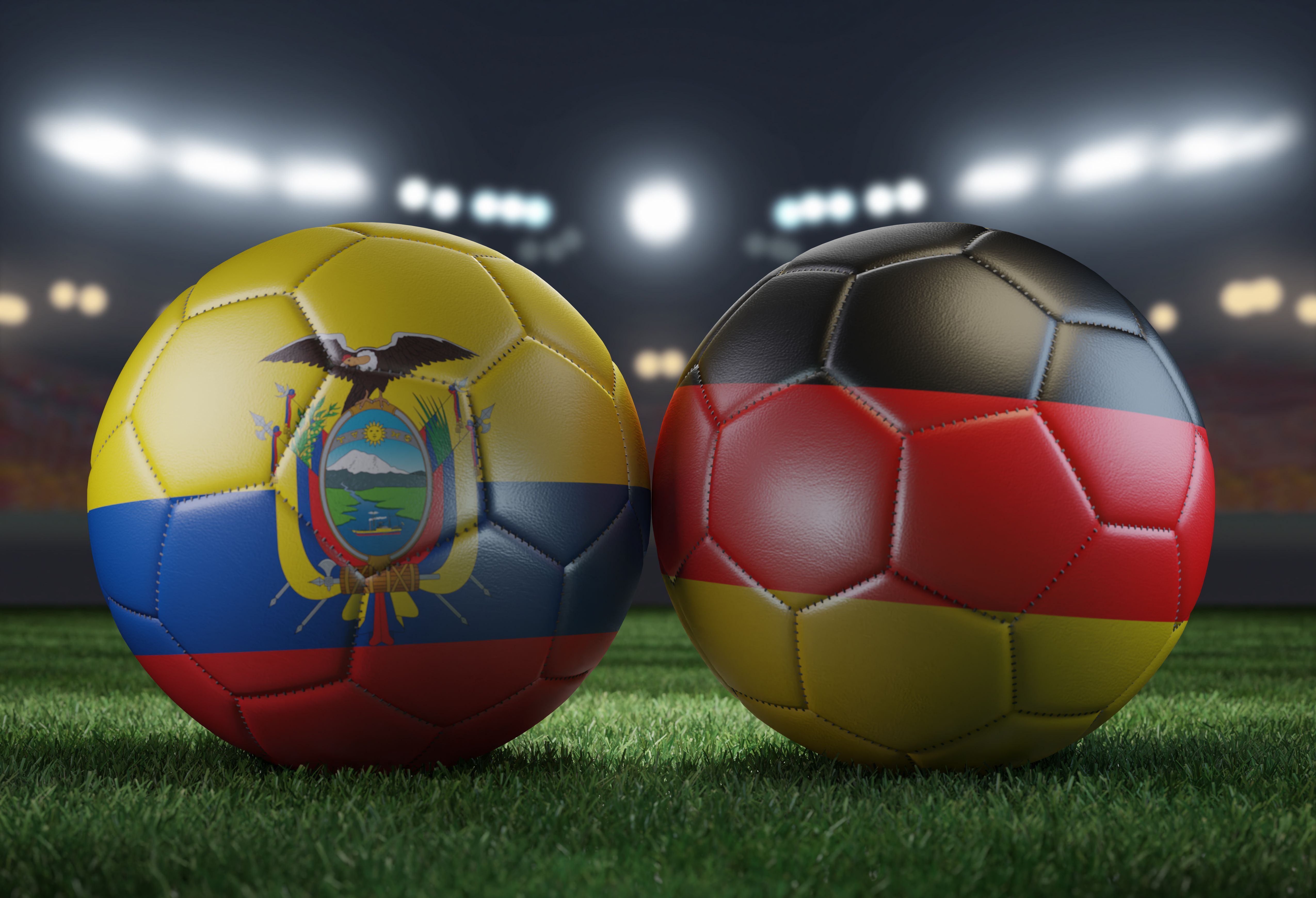Two soccer balls in flags colors on a stadium blurred background. Ecuador vs Germany. 3D image.