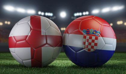 Two soccer balls in flags colors on a stadium blurred background. England vs Croatia. 3D image.