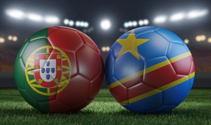 Two soccer balls in flags colors on a stadium blurred background. Portugal vs DR Congo. 3D image.