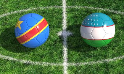 Soccer balls with congo and uzbekistan flags on green football pitch background 3d