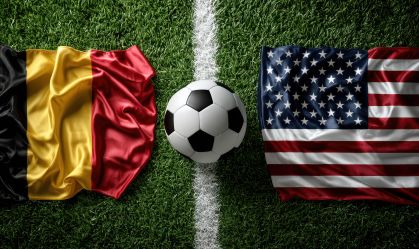 Dramatic Top View of Soccer Ball Between Belgium and USA Flags on Turf